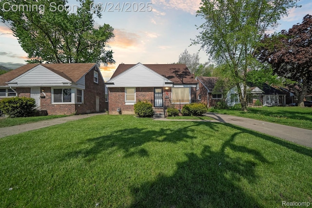 18625 Codding St, Detroit, MI 48219 - view of front facade with brick siding and a front yard