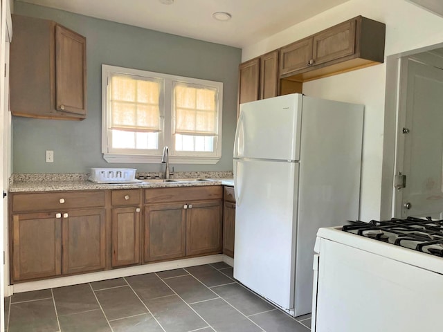 3254 W W Philadelphia St, Detroit, MI 48206 - kitchen featuring white appliances and brown cabinets