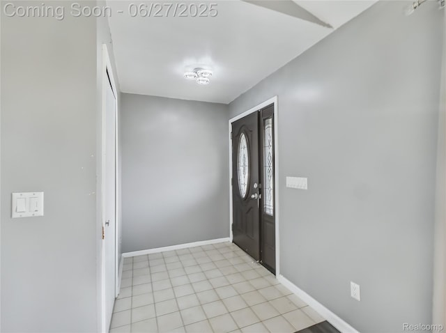 5050 Burton Rd, Capac, MI 48014 - foyer entrance with baseboards and light tile patterned flooring