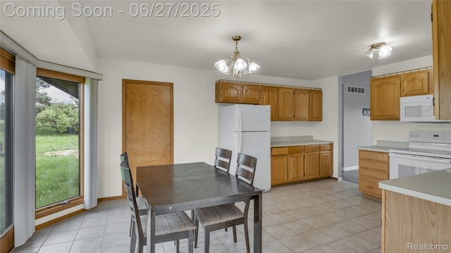 5050 Burton Rd, Capac, MI 48014 - kitchen with white appliances, light countertops, pendant lighting, and light tile patterned floors