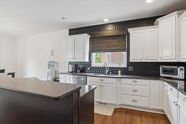 46746 Merion Cir, Northville, MI 48168 - kitchen featuring stainless steel dishwasher, white cabinets, tasteful backsplash, and recessed lighting