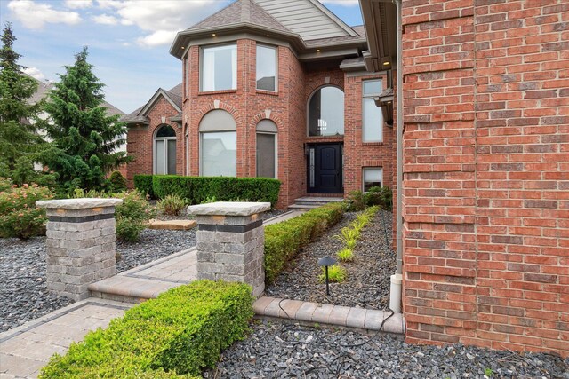 46746 Merion Cir, Northville, MI 48168 - view of front facade with brick siding and roof with shingles