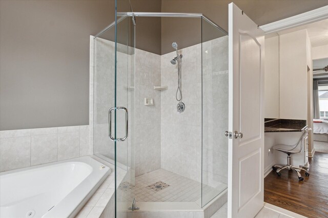 46746 Merion Cir, Northville, MI 48168 - ensuite bathroom with a garden tub, a shower stall, and wood finished floors