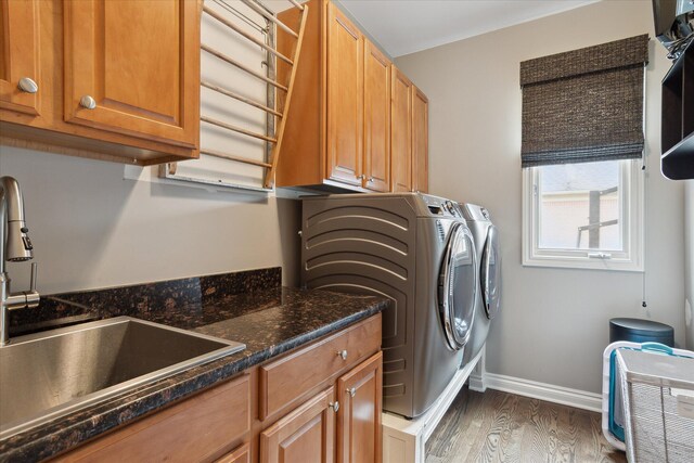 46746 Merion Cir, Northville, MI 48168 - laundry area featuring washer and dryer, wood finished floors, and cabinet space