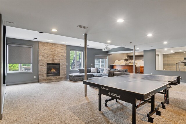 46746 Merion Cir, Northville, MI 48168 - playroom featuring carpet floors, a stone fireplace, and recessed lighting