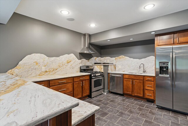 46746 Merion Cir, Northville, MI 48168 - kitchen featuring appliances with stainless steel finishes, wall chimney exhaust hood, tasteful backsplash, brown cabinets, and light stone countertops