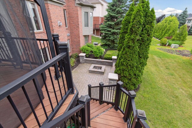 46746 Merion Cir, Northville, MI 48168 - view of grassy yard with a patio area, an outdoor fire pit, and a deck