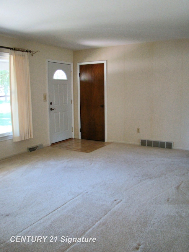 4215 S Wayside Dr, Saginaw, MI 48603 - entryway featuring carpet floors