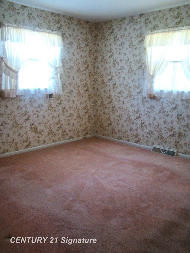 4215 S Wayside Dr, Saginaw, MI 48603 - spare room featuring light colored carpet and wallpapered walls