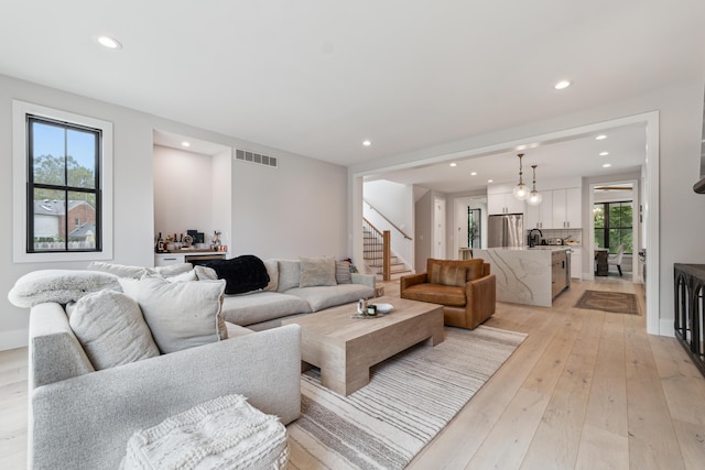 1053 Canterbury St, Birmingham, MI 48009 - living room with recessed lighting, stairs, and light wood-style floors