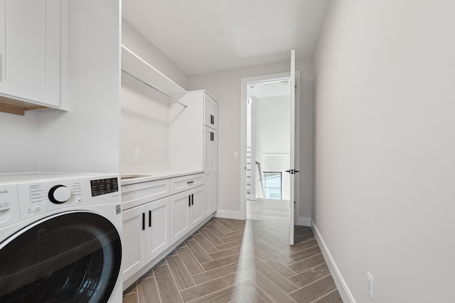 1053 Canterbury St, Birmingham, MI 48009 - laundry room with washer / dryer, cabinet space, and parquet floors