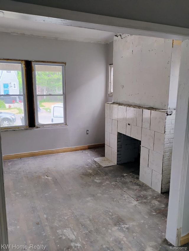 12749 Washburn St, Detroit, MI 48238 - unfurnished living room featuring baseboards and a fireplace