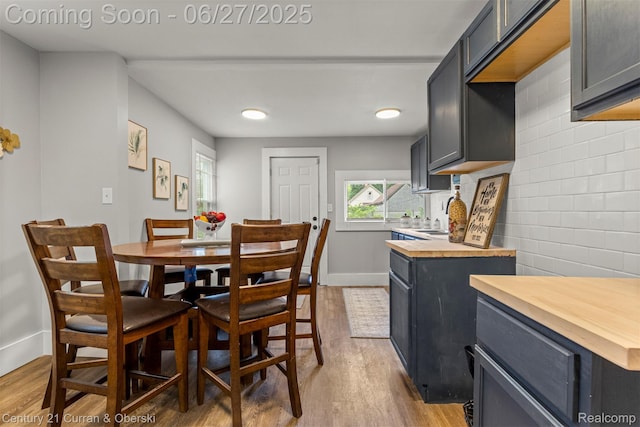 3917 Bewick St, Detroit, MI 48214 - dining area featuring wood finished floors and plenty of natural light