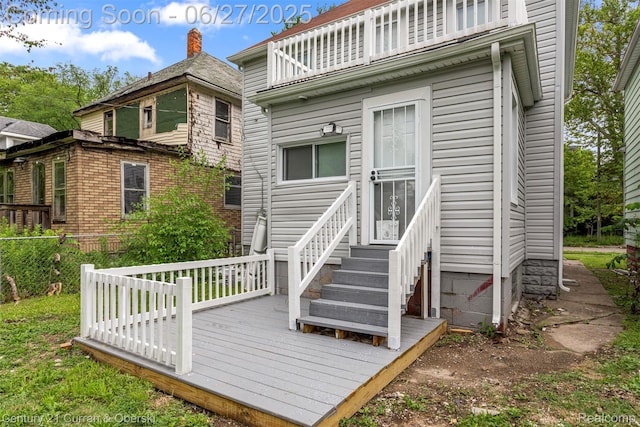 3917 Bewick St, Detroit, MI 48214 - rear view of property with entry steps, a wooden deck, and a balcony