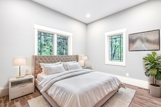 2685 Fry Rd, Highland, MI 48357 - bedroom with wood finished floors and recessed lighting