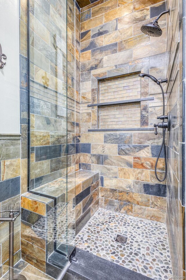 2685 Fry Rd, Highland, MI 48357 - bathroom featuring a stall shower