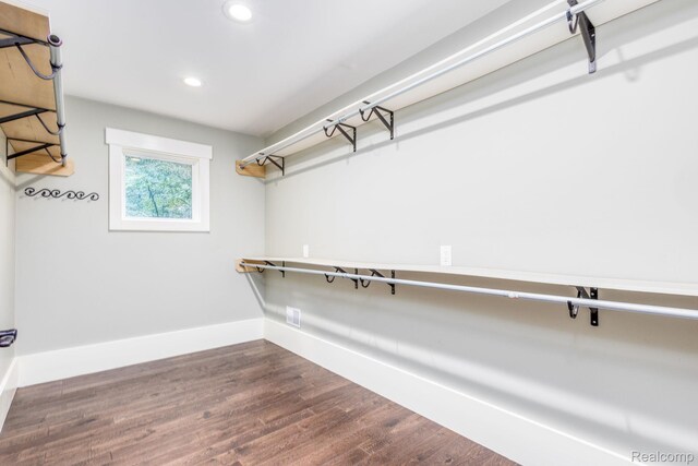 2685 Fry Rd, Highland, MI 48357 - walk in closet featuring wood finished floors
