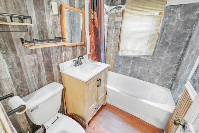 2211 Avon St, Saginaw, MI 48602 - bathroom featuring vanity, shower / bath combination with curtain, and wood finished floors