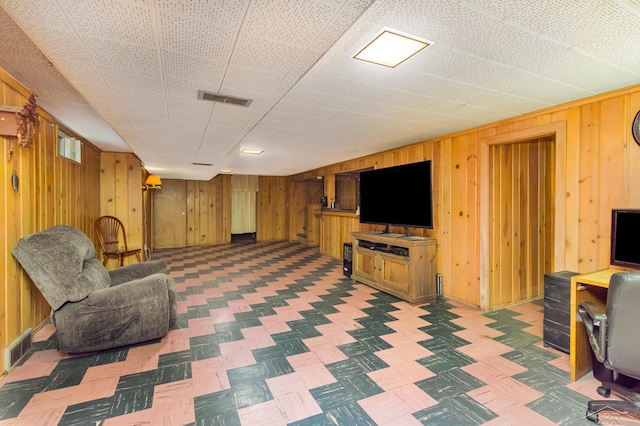 239 Heyn St, Saginaw, MI 48602 - living room featuring wooden walls and baseboards