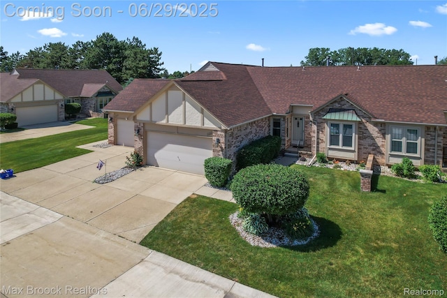 15653 Heather Ridge Trl, Clinton Township, MI 48038 - view of front of property with a garage, driveway, a front yard, roof with shingles, and brick siding