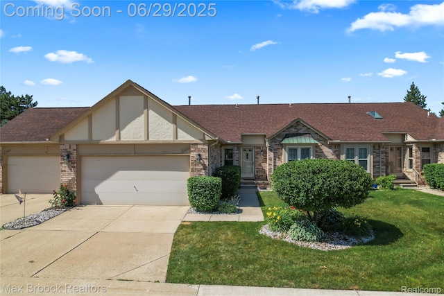 15653 Heather Ridge Trl, Clinton Township, MI 48038 - view of front of house with an attached garage, a front lawn, concrete driveway, brick siding, and a shingled roof