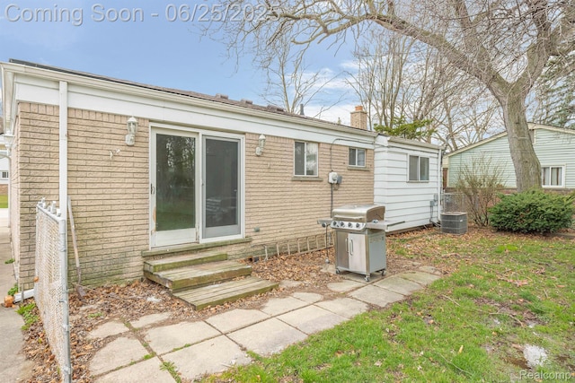 22323 Gordon Rd, Saint Clair Shores, MI 48081 - back of house with entry steps and a chimney