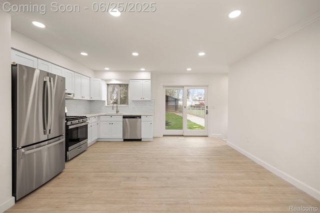 22323 Gordon Rd, Saint Clair Shores, MI 48081 - kitchen with stainless steel appliances, light countertops, white cabinetry, recessed lighting, and light wood-style floors