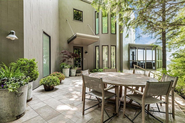 9182 Hemlock Ln, Bridgman, MI 49106 - view of patio with outdoor dining area and a sunroom