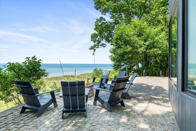 9182 Hemlock Ln, Bridgman, MI 49106 - view of patio / terrace with a fire pit and a water view