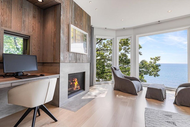 9182 Hemlock Ln, Bridgman, MI 49106 - office featuring a fireplace with flush hearth, a water view, light wood-style flooring, and recessed lighting