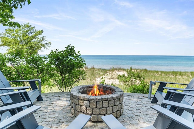 9182 Hemlock Ln, Bridgman, MI 49106 - view of patio with an outdoor fire pit and view of water and beach