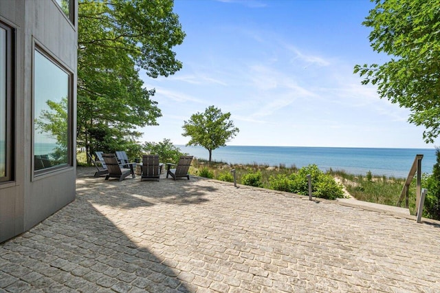9182 Hemlock Ln, Bridgman, MI 49106 - view of patio featuring view of water and beach