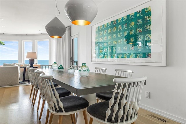 9182 Hemlock Ln, Bridgman, MI 49106 - dining room featuring baseboards and a water view