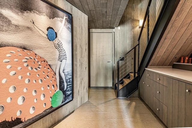 9182 Hemlock Ln, Bridgman, MI 49106 - corridor featuring stairs, wood walls, and wood ceiling