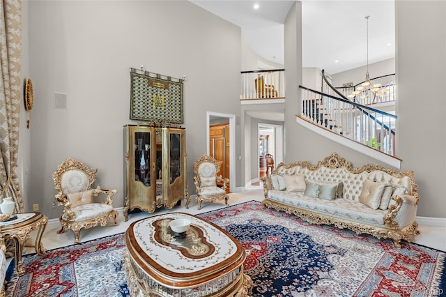 8356 Misty Mdws, Grand Blanc, MI 48439 - living area with a chandelier, a high ceiling, and stairs
