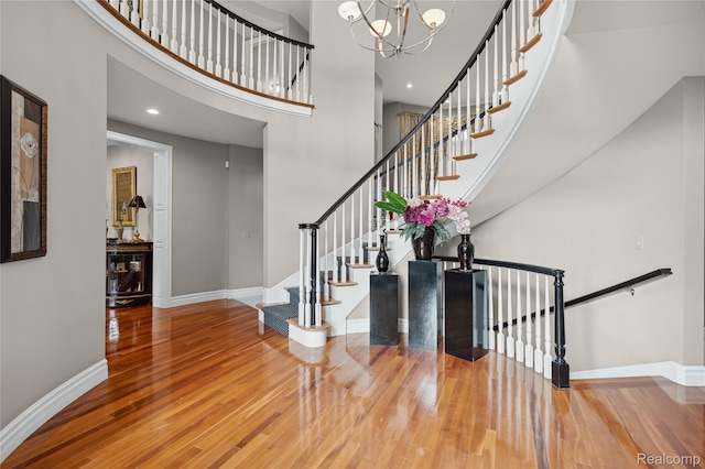 8356 Misty Mdws, Grand Blanc, MI 48439 - foyer with wood finished floors, a high ceiling, a chandelier, and recessed lighting