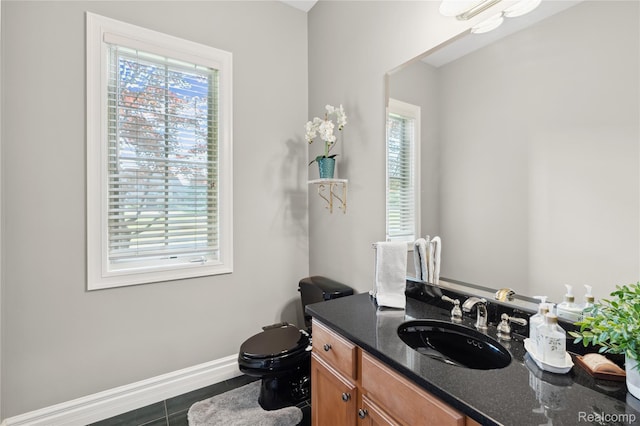 8356 Misty Mdws, Grand Blanc, MI 48439 - half bath featuring healthy amount of natural light, vanity, and tile patterned floors