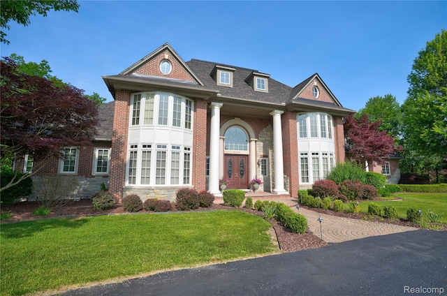 8356 Misty Mdws, Grand Blanc, MI 48439 - neoclassical / greek revival house featuring a front yard, french doors, and brick siding