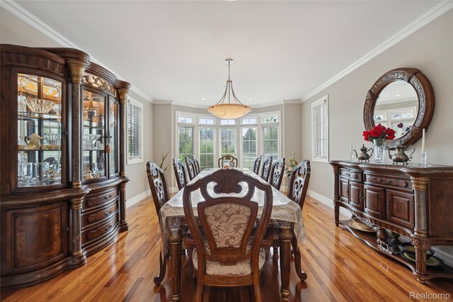 8356 Misty Mdws, Grand Blanc, MI 48439 - dining area featuring light wood-type flooring and crown molding