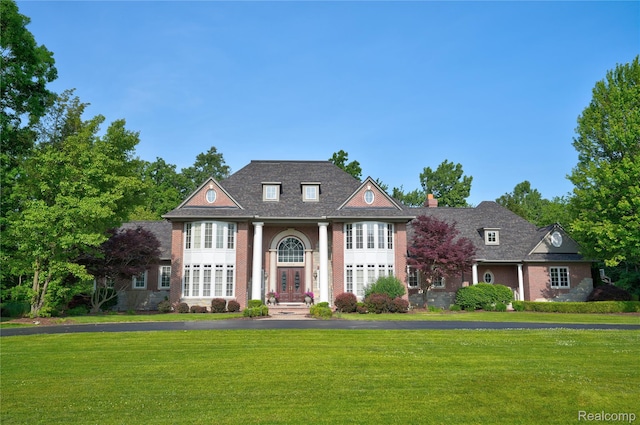 8356 Misty Mdws, Grand Blanc, MI 48439 - greek revival inspired property featuring a front lawn and french doors