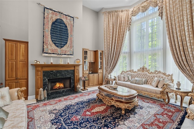 8356 Misty Mdws, Grand Blanc, MI 48439 - living area with a high ceiling and a premium fireplace