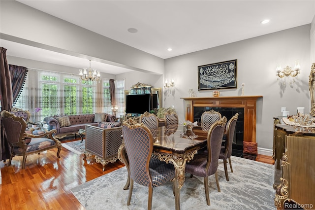 8356 Misty Mdws, Grand Blanc, MI 48439 - dining room featuring a chandelier, wood finished floors, and recessed lighting