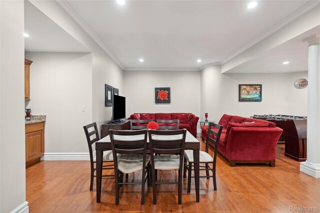 8356 Misty Mdws, Grand Blanc, MI 48439 - dining room featuring light wood-style flooring, recessed lighting, ornamental molding, and decorative columns