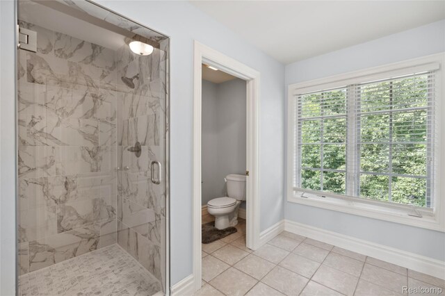 8356 Misty Mdws, Grand Blanc, MI 48439 - bathroom featuring a marble finish shower, healthy amount of natural light, and tile patterned flooring