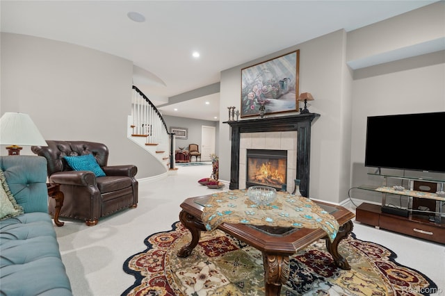 8356 Misty Mdws, Grand Blanc, MI 48439 - carpeted living area with a tiled fireplace, stairway, and recessed lighting