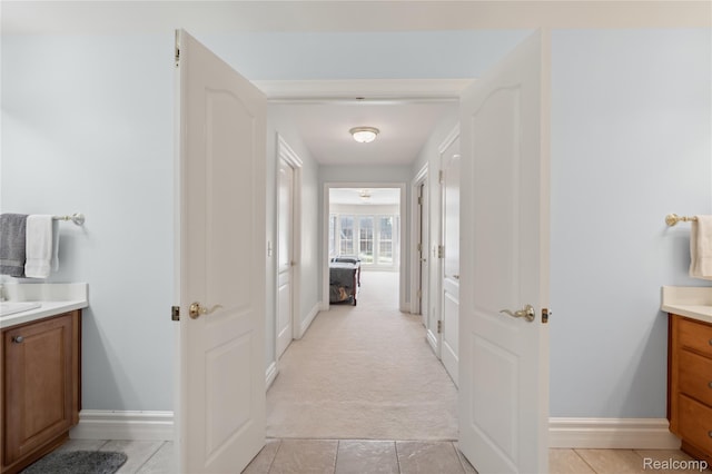 8356 Misty Mdws, Grand Blanc, MI 48439 - hall featuring light colored carpet and light tile patterned flooring