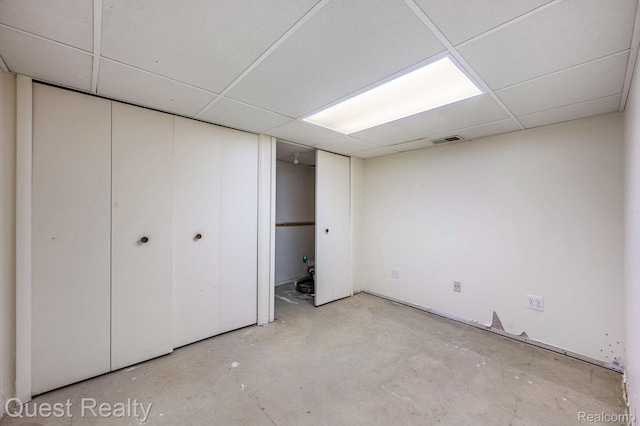 28041 Gettysburg St, Farmington, MI 48331 - unfurnished bedroom with a paneled ceiling and concrete flooring