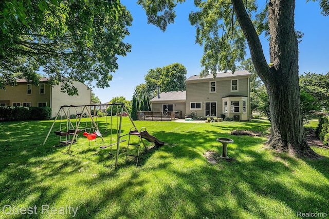 28041 Gettysburg St, Farmington, MI 48331 - view of green lawn featuring a playground and an outdoor fire pit
