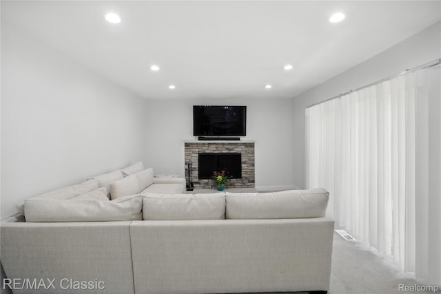 7027 Beverly Crest Dr, West Bloomfield, MI 48322 - living room featuring recessed lighting, a fireplace, and carpet floors