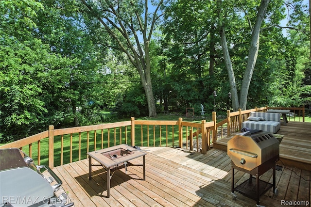 7027 Beverly Crest Dr, West Bloomfield, MI 48322 - wooden terrace with view of scattered trees, a yard, area for grilling, and an outdoor fire pit